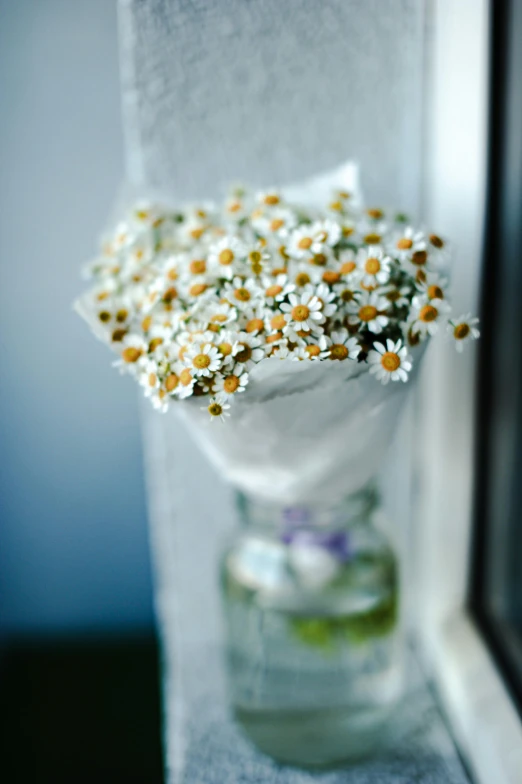 a bunch of wild flowers inside of a glass jar