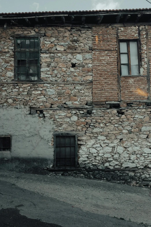 a brick building that has many windows on it