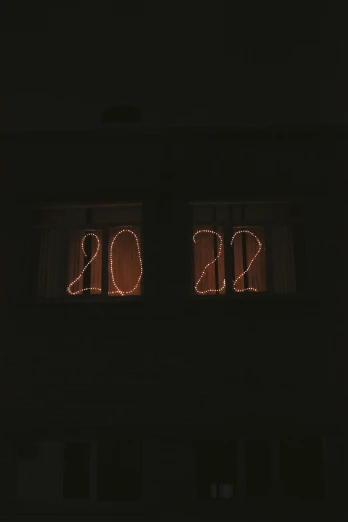 two windows that are decorated with lights