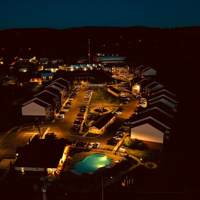 an aerial view of many cars parked in a lot