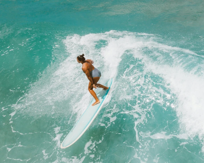 a person on a surfboard surfing in the ocean