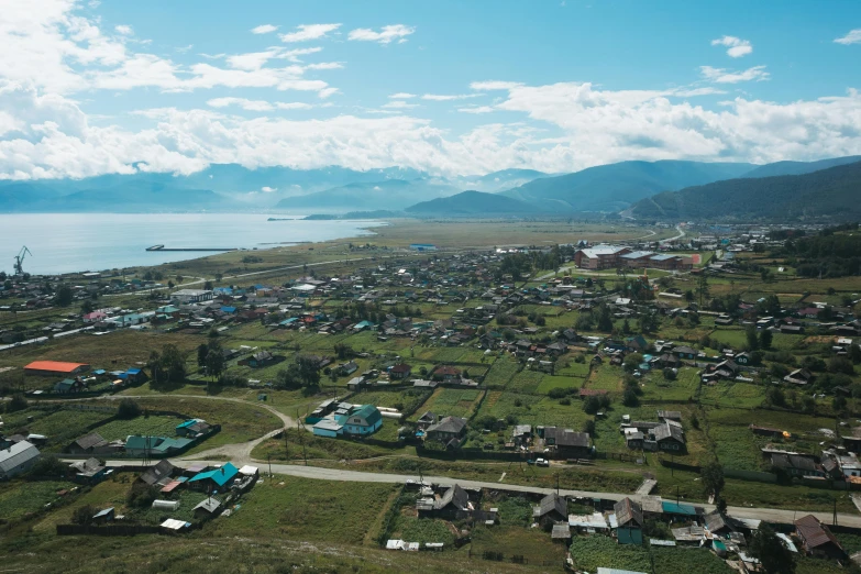 a green area with lots of houses in the foreground