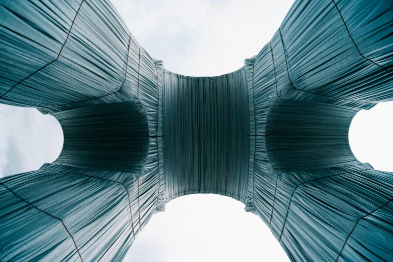 multiple angles of metal structures with white sky in the background