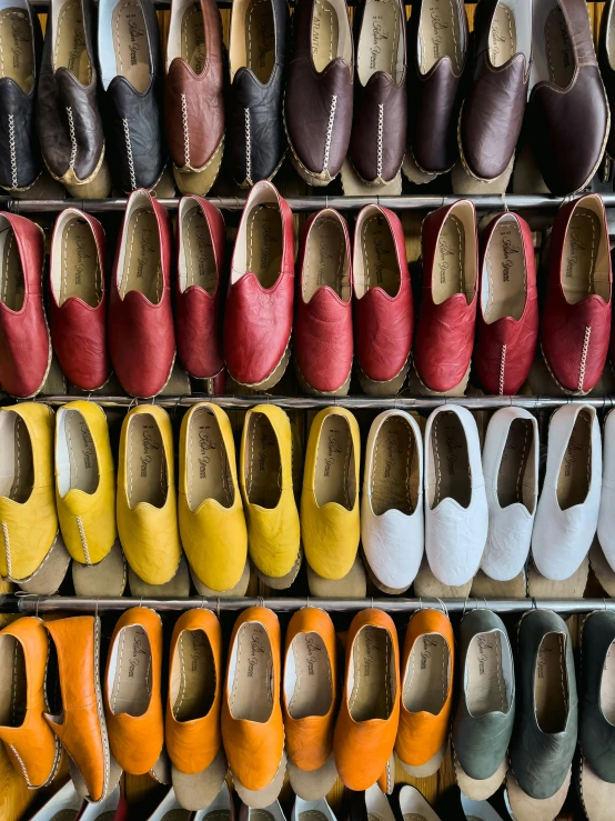 a large display of shoes with different colors