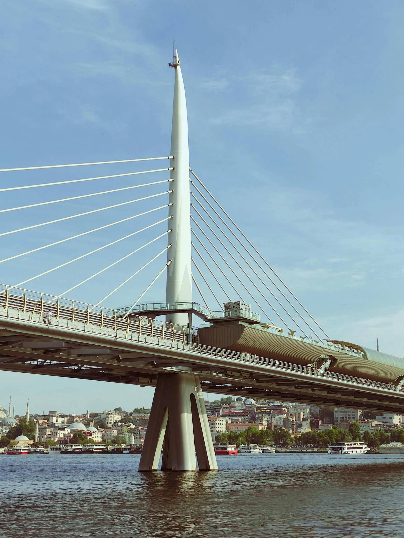 an over pass bridge spanning a river in the city