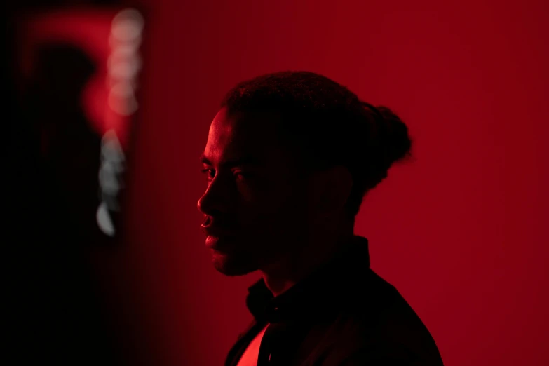 a woman looking back at the camera with red light on