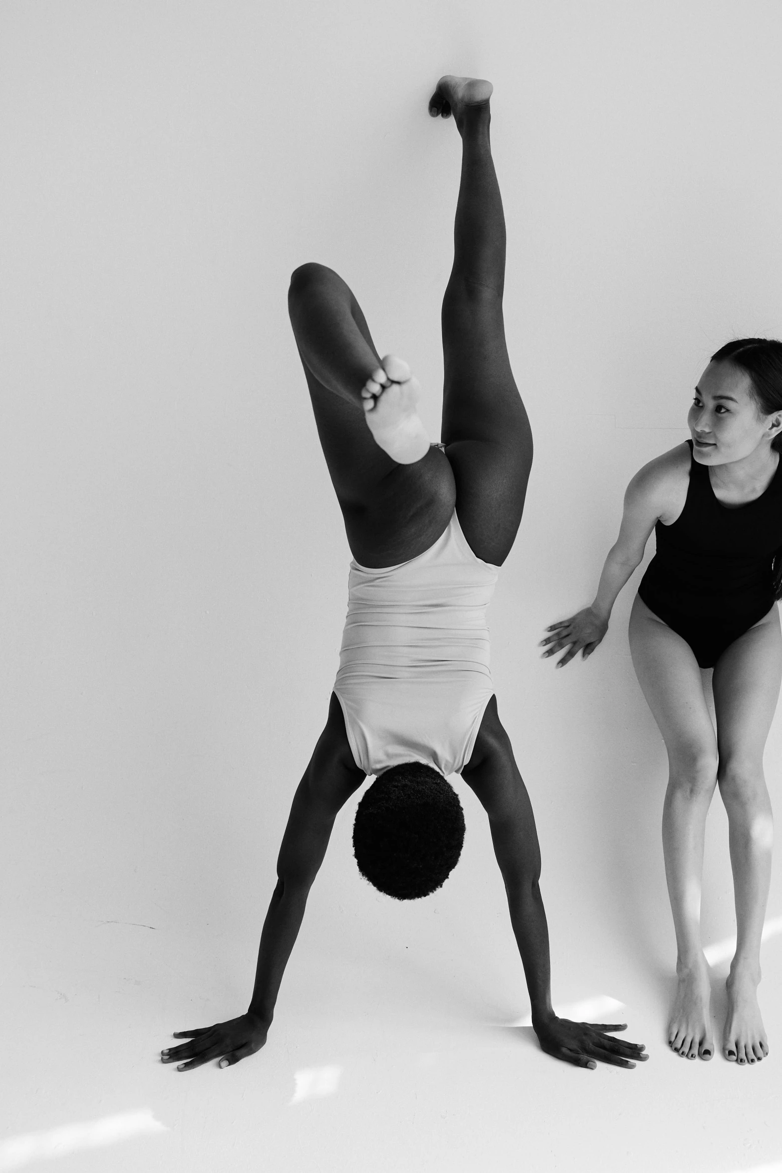 a man and a woman doing gymnastics