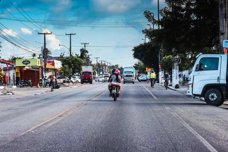 an empty city street with vehicles and people