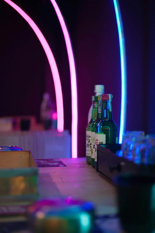 bottle, jar, scissors and pipe on a table