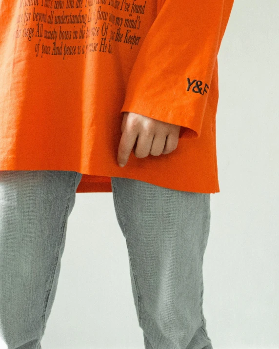 there is a orange shirt with words written on it