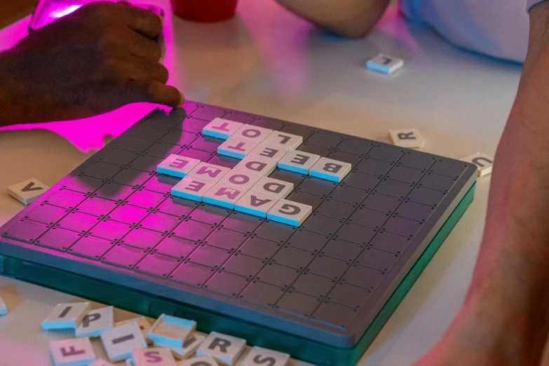 several people play with a game on the table