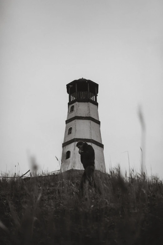 an older lighthouse on the top of a hill