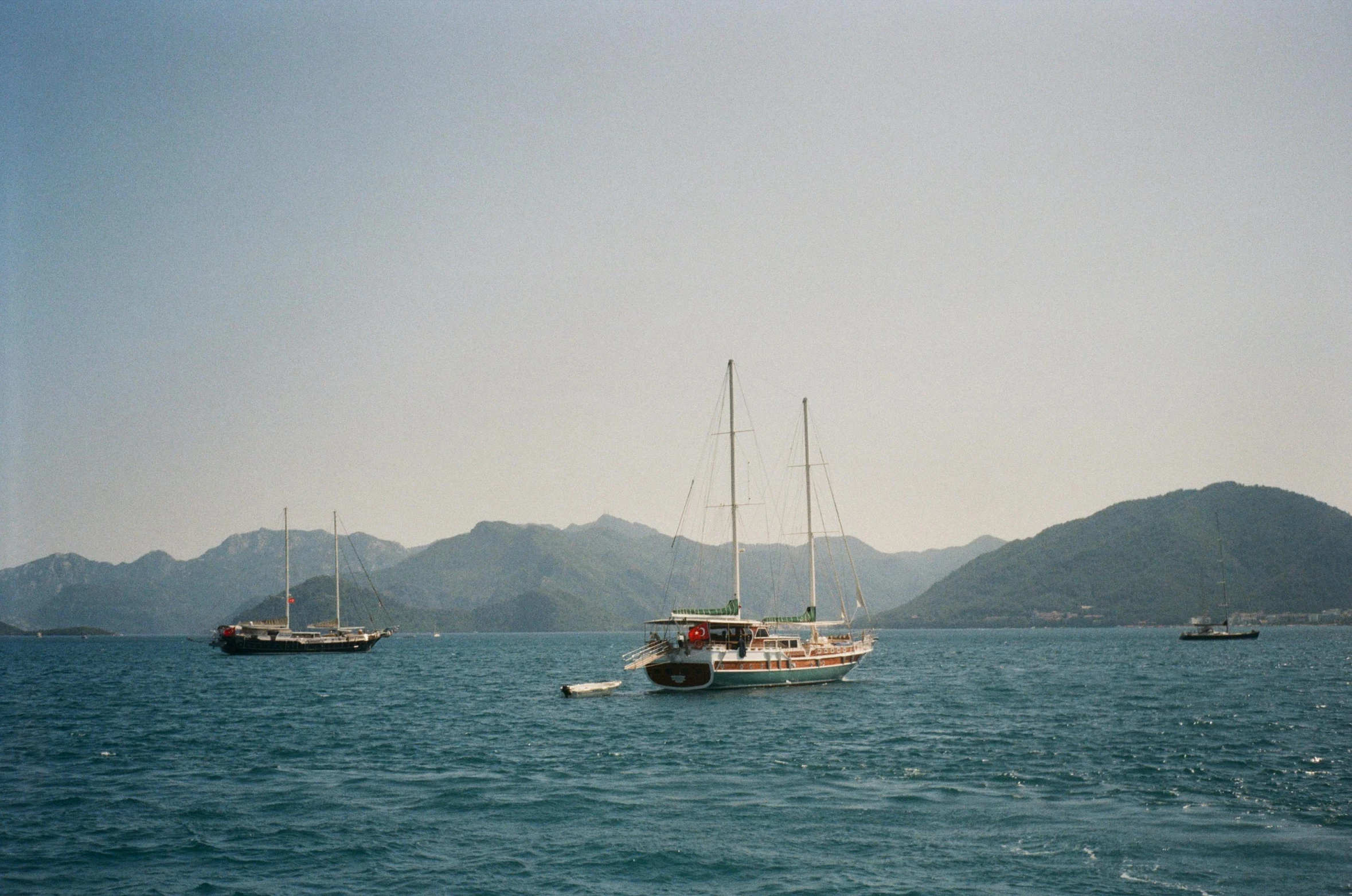 two ships out in the open water off the coast