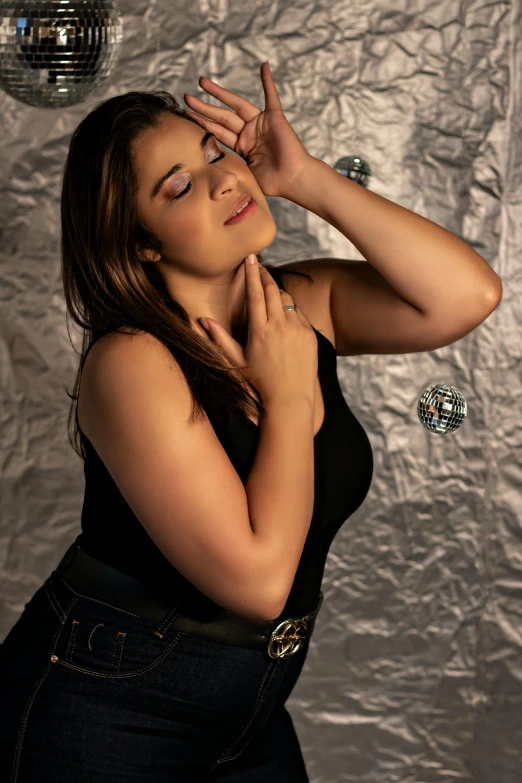 a woman posing for a picture while wearing an animal print belt