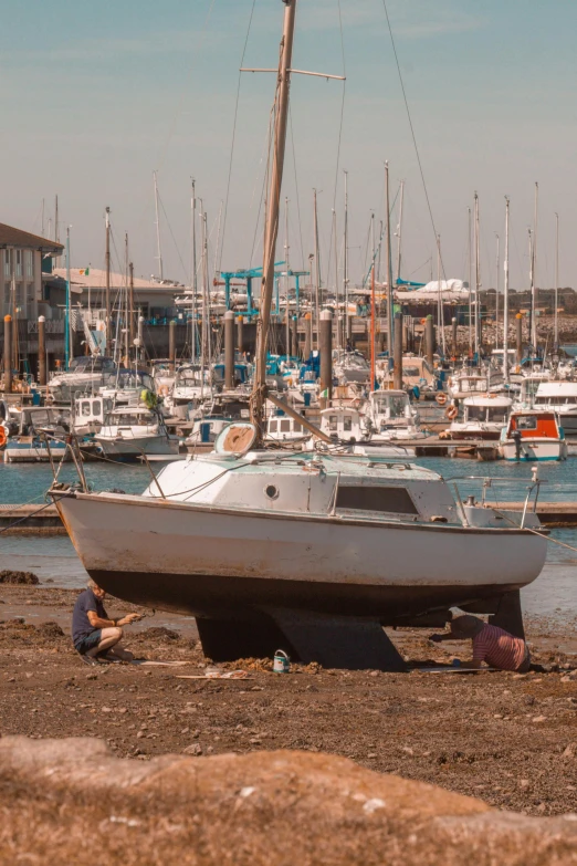 a sailboat is moored in a marina