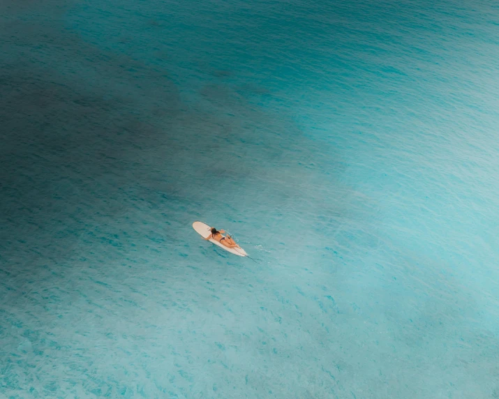 a single person is sitting on a small boat