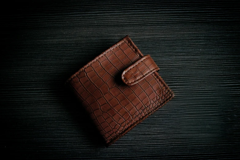 an elegant handmade leather wallet with a small on