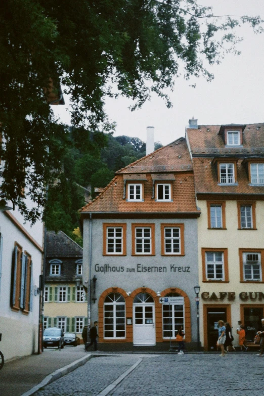 an intersection in front of several older buildings