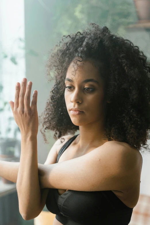 an image of a woman that is in the middle of doing yoga