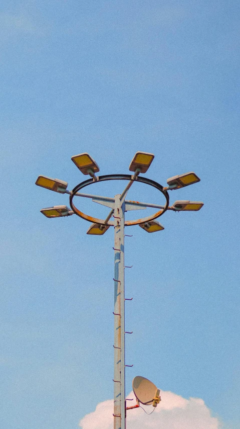 the top of a tower that has two wind chimes in it