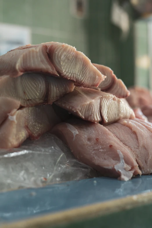 raw meat sit on top of an unwrapped table