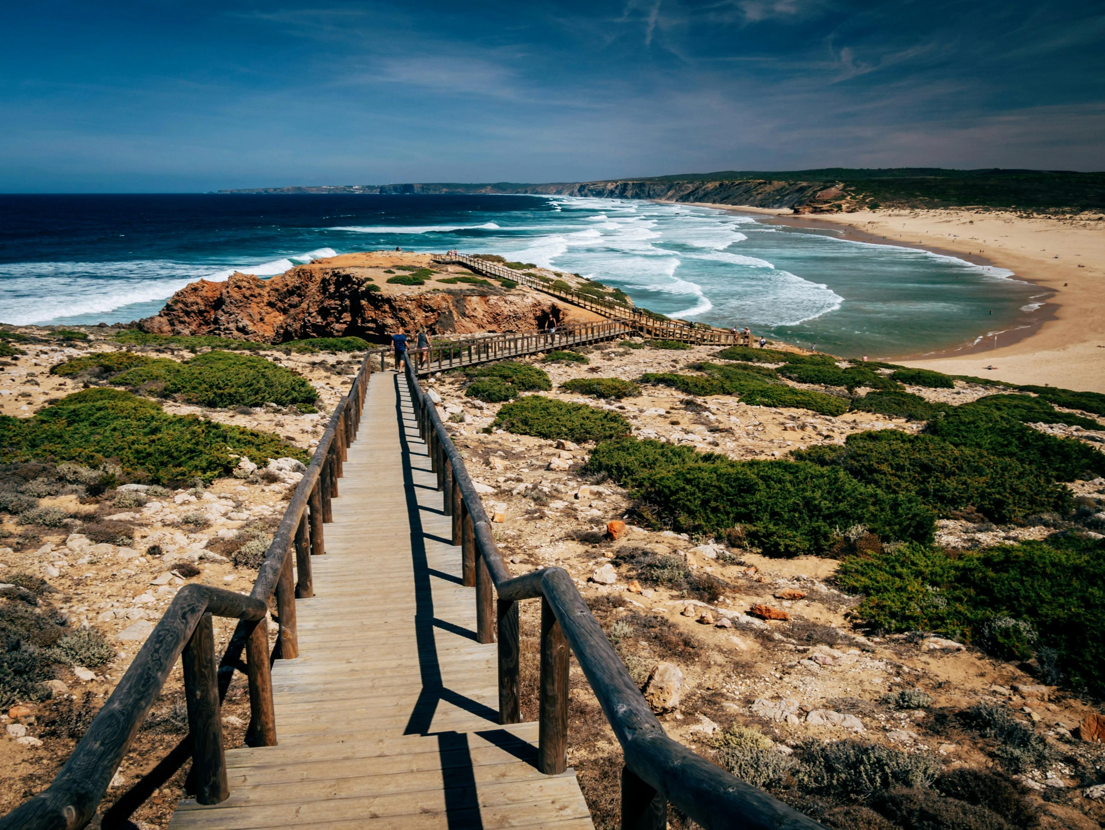 an image of a long ramp going down to the ocean