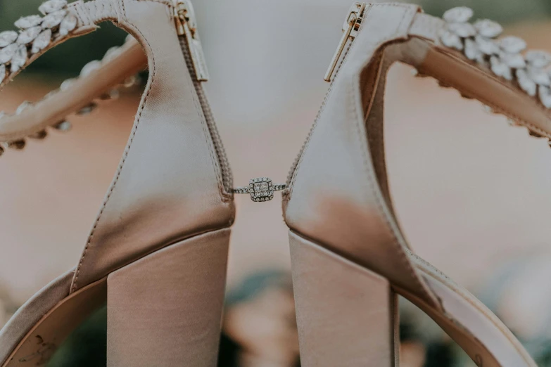 a pair of shoes with jeweled straps