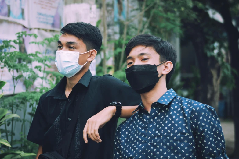 two men with face masks on