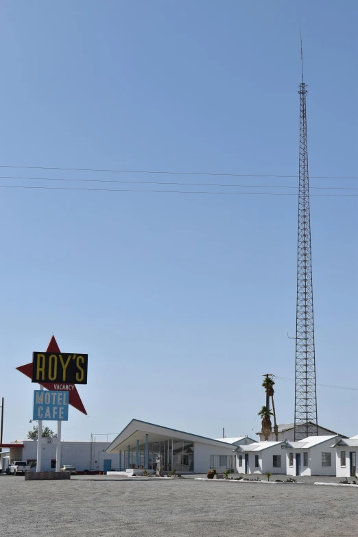 a building sits outside of a gas station