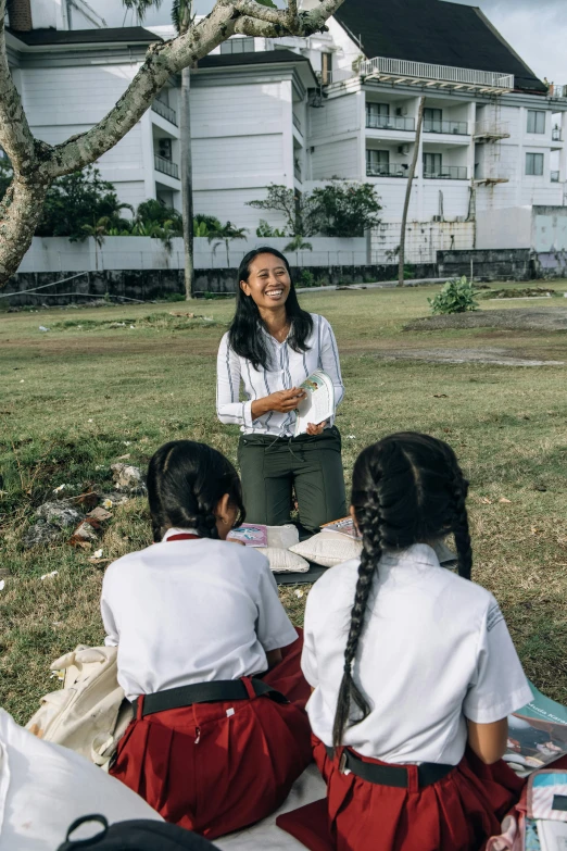 two female students sit with their backs facing the camera