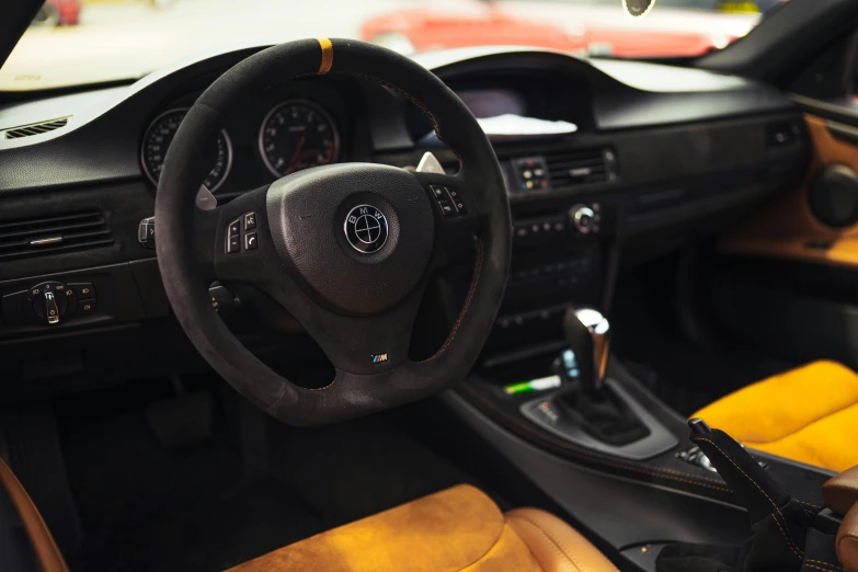 a po of a car with steering wheel and dashboard