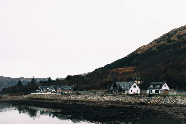 a small town near the water with lots of houses on each side