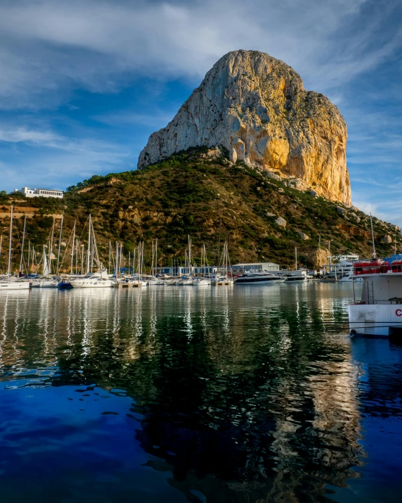 a rocky outcropping in a marina on the water