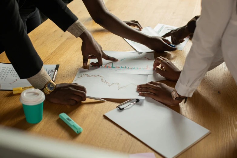 three people are working together with different objects