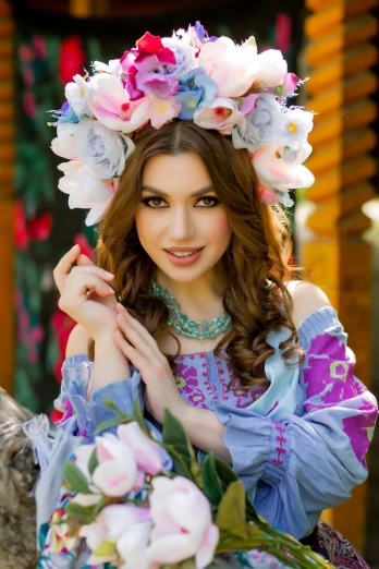 a young woman poses for a po in a floral crown