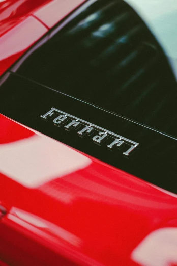 a close up view of the tail end of a red sports car