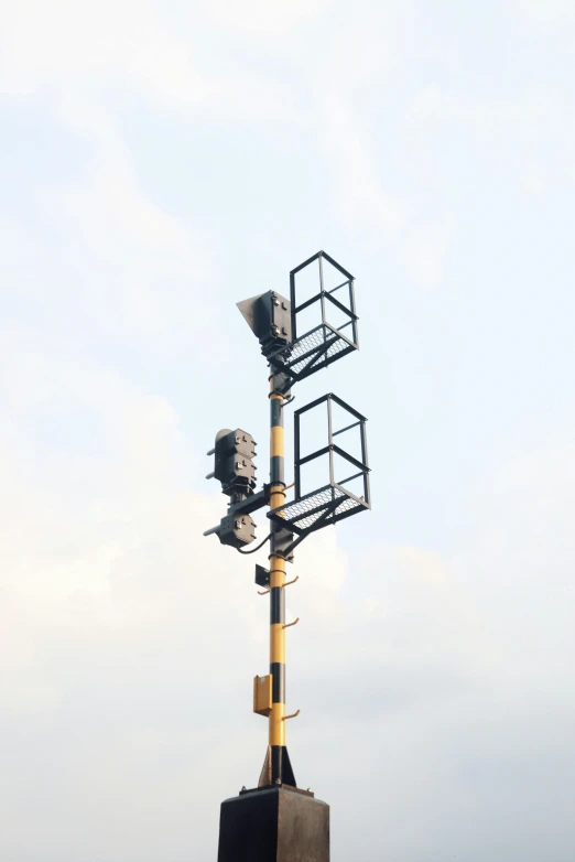 a tower has several antennas on top