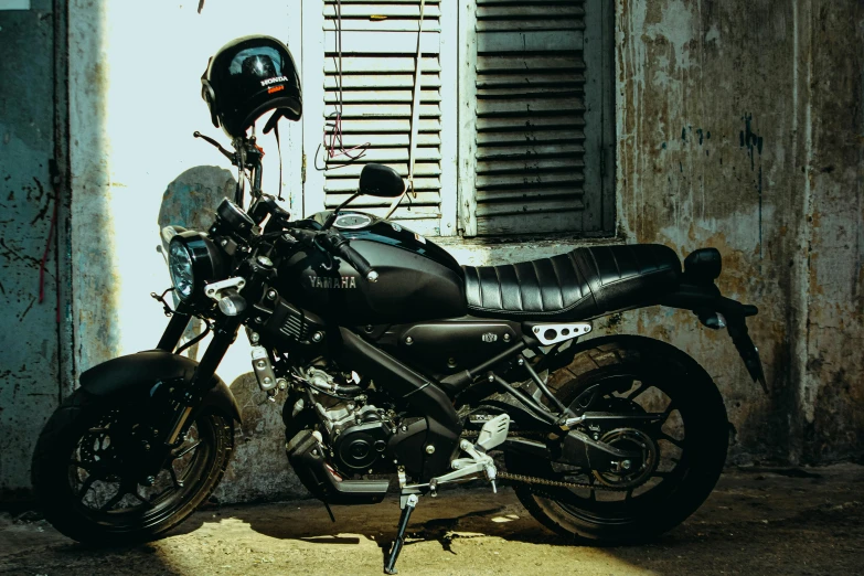 a motorcycle sitting in the sun on the street