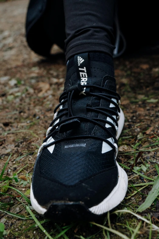 a man in black and white shoes with the number four on their shoe