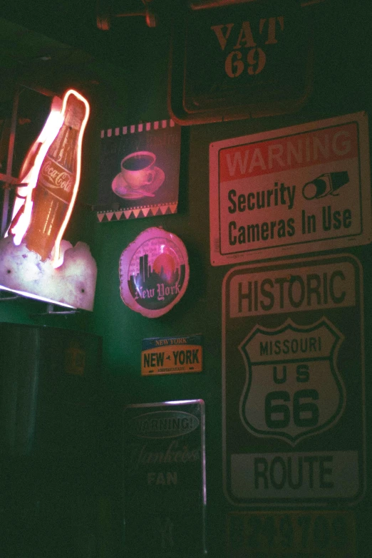 there is an array of neon signs on display