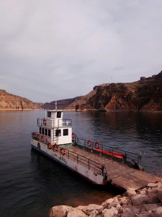 a large ferry sitting in the middle of the water