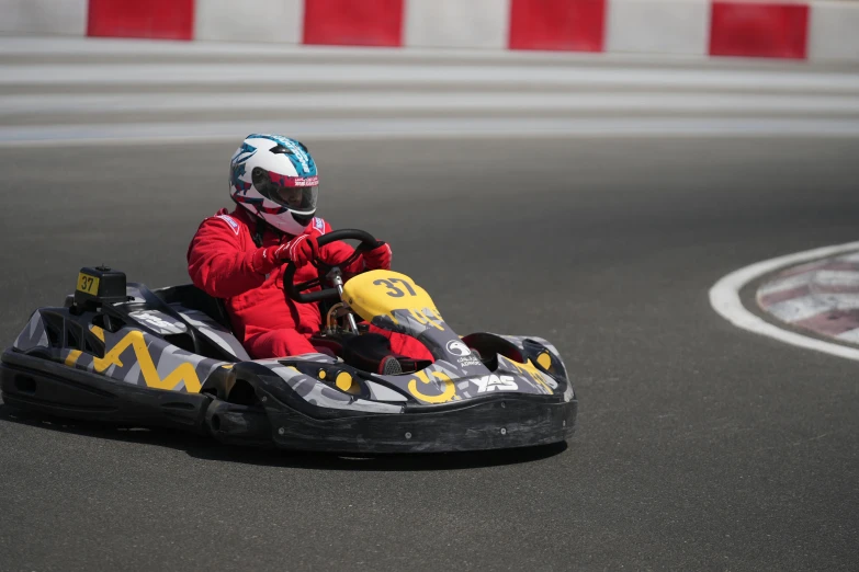 a person in a go - cart race on the track