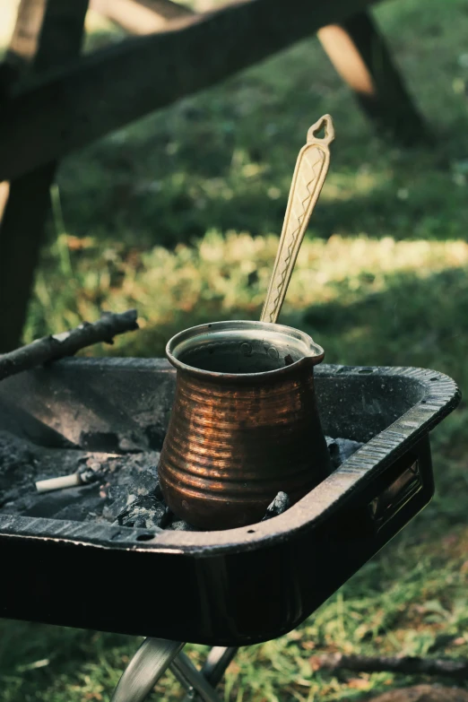 an old rusty tin can with a spoon inside