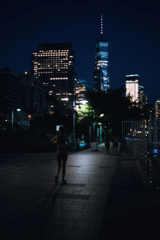 a person with their skate board in the night