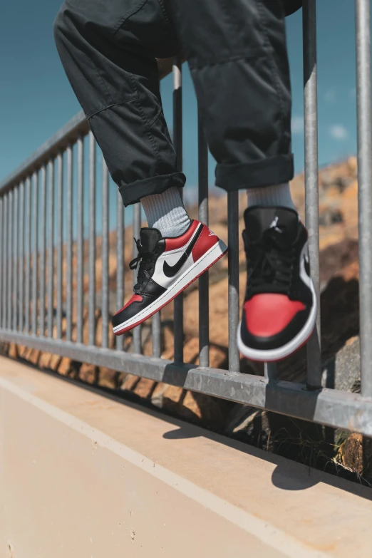 a pair of red and black shoes is shown