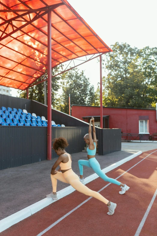 a pair of girls in tight underwear performing exercises