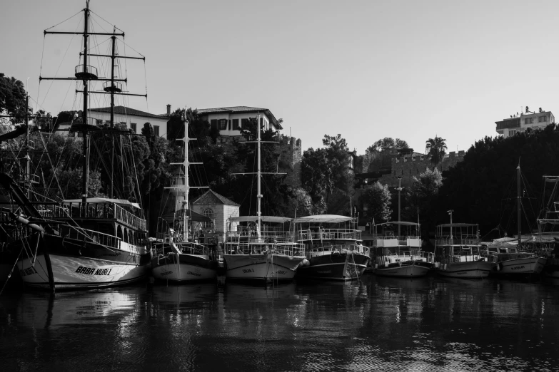 the boats are docked at the dock at the lake