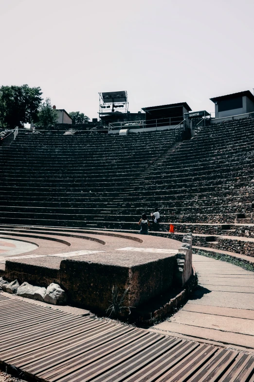 a man on a skateboard standing in the middle of some stairs