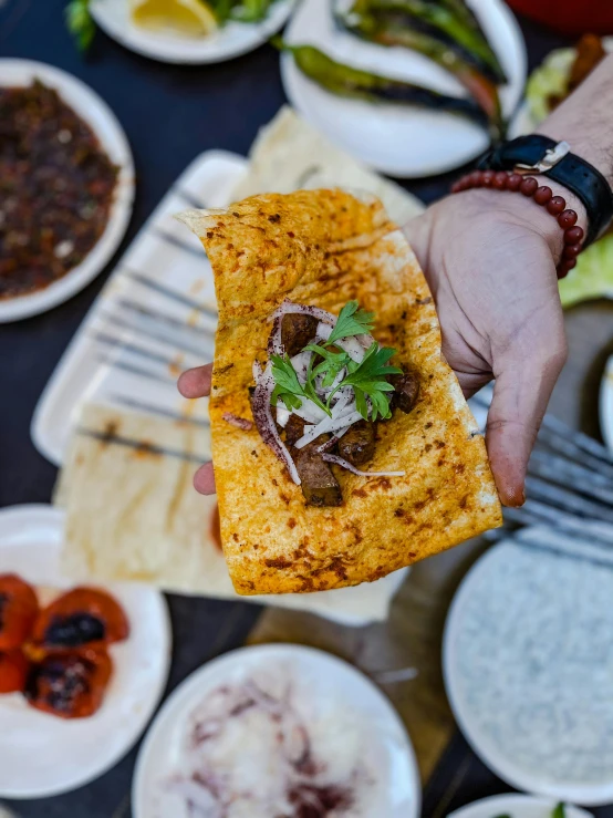 someone is eating a quesadilla on a plate