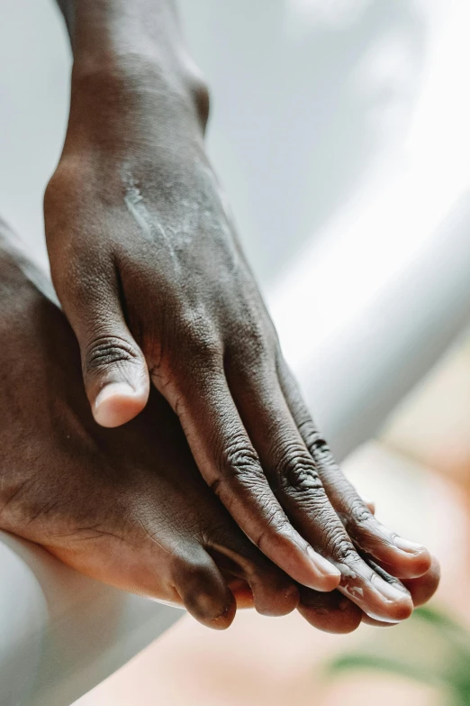 a person holding their hand up to their chest